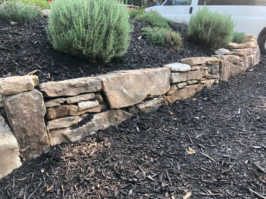 Stone retaining wall with Rocks Landscaping by Allenworks